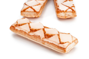 Delicious puff pastry on white background closeup view
