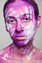 Female face with handprints