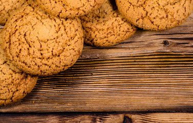 Stack of the oatmeal cookies on wooden table