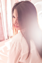 Portrait of beautiful Asian woman sit on the bed in the morning