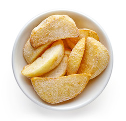 Bowl of frozen potato wedges isolated on white background, top view