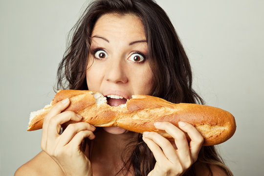 Hungry Woman Eating Baguette