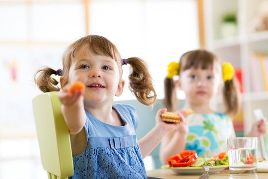 kids eating healthy food in kindergarten or at home
