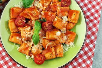 Ravioli with tomato sauce and basil