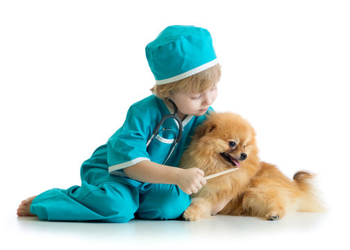 Kid weared doctor clothes playing veterinarian