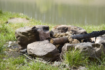 Fire place at the campsite by the lake