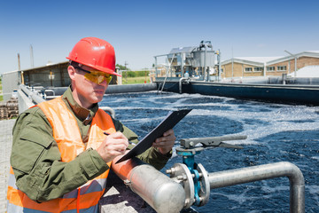 An engineer controlling a quality of water ,aerated activated sludge tank at a waste water treatment plant, writing facts