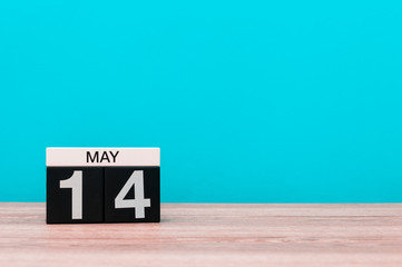 May 14th. Day 14 of month, calendar on turquoise background. Spring time, empty space for text. Astronomy Day. World Fair Trade DAY