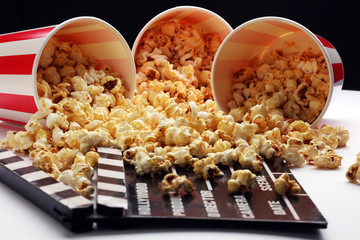 Cinema concept with popcorn and clapperboard