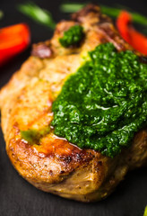 Grilled meat with vegetables on the pan. Selective focus.