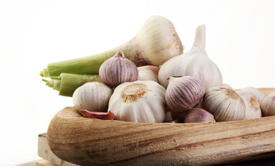 Garlic. Garlic Cloves and Garlic Bulb in vintage wooden bowl.