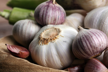 Garlic. Garlic Cloves and Garlic Bulb in vintage wooden bowl.