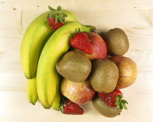 Fresh fruit isolated on wooden background - top view