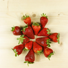 Strawberries isolated on wooden background - top view