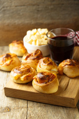 Homemade cheese buns with tomato sauce and herbs