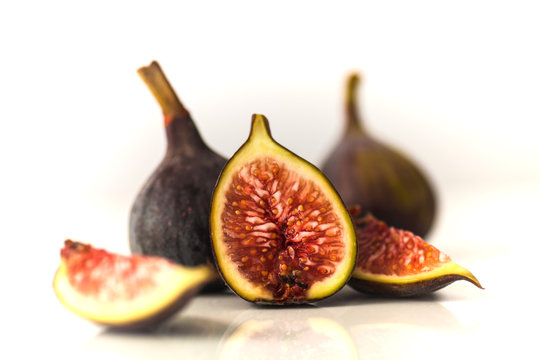 Figs on a reflective white surface
