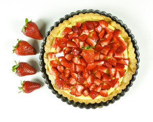 Strawberry pie on white background - top view