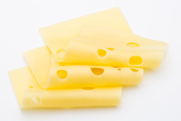 Cheese slices on white background cutout.