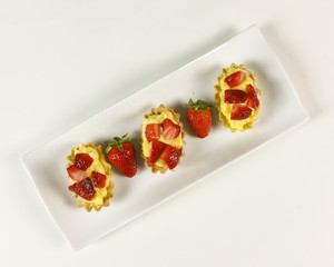 Strawberry pie on white background - top view