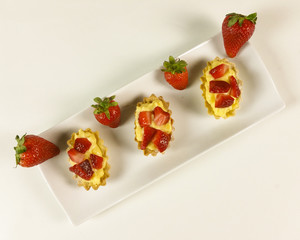Strawberry pie on white background - top view