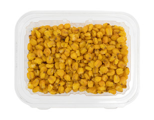 Toasted corn nuts in a plastic container isolated on a white background.