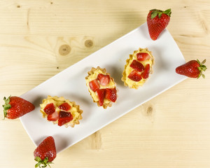 Strawberry pie on wooden background - top view