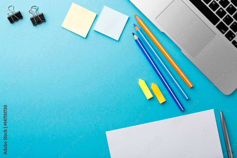 Aufkleber start of morning work office desk with computer laptop pencil sheet paper notebook pen blue texture 