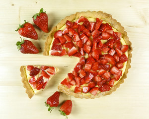 Strawberry pie on wooden background - top view