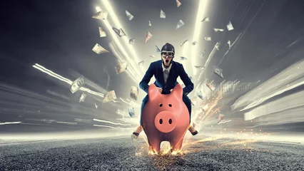 Fotobehang Young businesswoman riding on piggy bank, isolated on white. Saving concept © Sergey Nivens