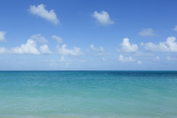 Fototapeta na wymiar Beach scene Antigua, showing sand, sea and blue sky
