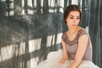woman with blowed dress by wind. sunny dance studio © sibstock