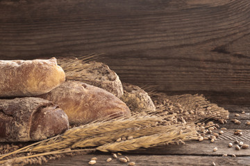 Different bread on a wooden background in dark tones