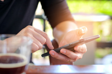 Hand holding a smart phone with white.