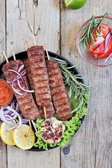 
    Kebab .Traditional meat kebab of minced beef or lamb with vegetables and herbs .Selective focus 