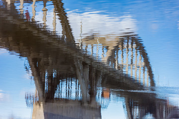 Reflection of bridge in water