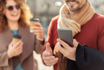 Guy messaging on phone during date