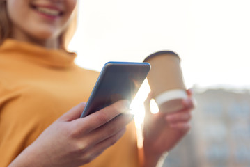 Cute girl using phone outdoors