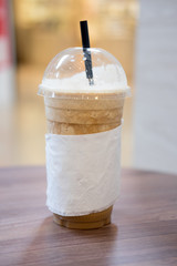 ice coffee frappe with straw in plastic cup