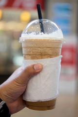 ice coffee frappe with straw in plastic cup