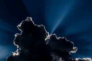 Rim light dark cloud and blue sky.