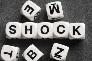 word shock on toy cubes