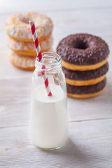 Donuts with milk on a light background