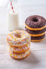 Donuts with milk on a light background