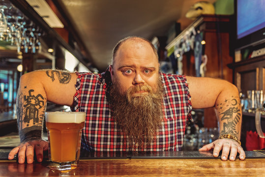 Bearded male working in pub