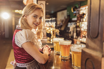 Outgoing woman having job in alehouse