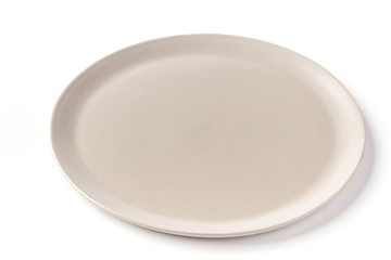 Flat round grey plate on a white background