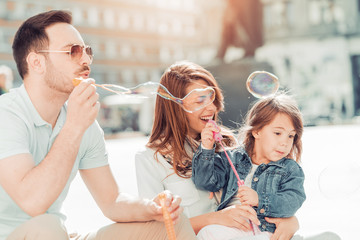 Happy young family in the city