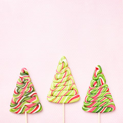 Lollipops sweets. Candy christmas, top view flat lay on pink background. Sweet sucker, lollipop, candy, isolated minimal concept above decoration, food background