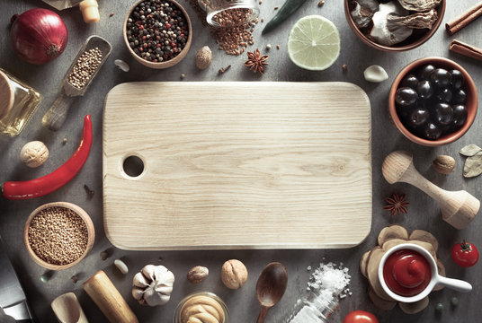 herbs and spices on wood background