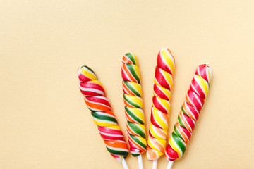 Lollipops sweets. Candy, top view flat lay on yellow background. Sweet sucker, lollipop, candy, isolated minimal concept above decoration, food background